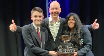 Student Receiving Debate Trophy